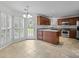 Bright kitchen has hardwood cabinets, stainless steel appliances, tile floors, and a breakfast nook at 9121 Four Acre Ct, Charlotte, NC 28210