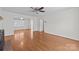 Spacious living room showcases hardwood floors and a cozy fireplace at 9121 Four Acre Ct, Charlotte, NC 28210