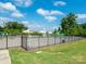 Fenced community pool area with umbrellas and play features at 9123 Magnolia Lily Ave, Charlotte, NC 28227