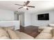 Inviting living room featuring a sectional sofa, dark wood floors, and a ceiling fan at 9123 Magnolia Lily Ave, Charlotte, NC 28227