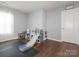 playroom with a grey mat, a large window, and laminate dark wood flooring at 9123 Magnolia Lily Ave, Charlotte, NC 28227