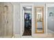 View of open walk-in closet from the bathroom with glass shower stall at 956 Herrons Ferry Rd, Rock Hill, SC 29730