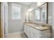 Well-lit bathroom featuring double vanity with granite countertop, and a large mirror at 956 Herrons Ferry Rd, Rock Hill, SC 29730