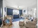 Bedroom features two cribs, rocking chair and blue accents at 956 Herrons Ferry Rd, Rock Hill, SC 29730