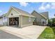 Detached garage with an open door and a concrete driveway at 956 Herrons Ferry Rd, Rock Hill, SC 29730