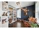 Stylish home office with custom shelving, elegant decor, and cozy seating at 956 Herrons Ferry Rd, Rock Hill, SC 29730