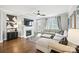 Bright living room featuring a fireplace, hardwood floors, comfortable seating and view to the back yard at 956 Herrons Ferry Rd, Rock Hill, SC 29730