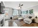 Cozy living room featuring a grey sectional sofa, hardwood floors, modern art and easy access to the back yard at 956 Herrons Ferry Rd, Rock Hill, SC 29730