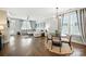 Bright living room with hardwood floors, modern lighting, and comfortable seating near a sunlit window and stylish artwork at 956 Herrons Ferry Rd, Rock Hill, SC 29730