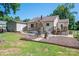 Relax in the home's backyard, which features a patio area and access to a detached garage at 1005 Noles Dr, Mount Holly, NC 28120