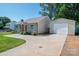 Well-maintained home with a detached garage and long driveway at 1005 Noles Dr, Mount Holly, NC 28120