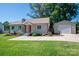 Lovely home with green lawn, detached garage, and welcoming driveway at 1005 Noles Dr, Mount Holly, NC 28120