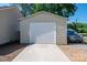 Image shows the home's detached garage and driveway at 1005 Noles Dr, Mount Holly, NC 28120