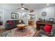 Inviting living room featuring stylish decor and a glimpse into the dining area at 1005 Noles Dr, Mount Holly, NC 28120