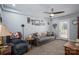 Relaxing living room with a couch, neutral carpet, and access to outdoor space at 1005 Noles Dr, Mount Holly, NC 28120