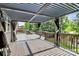Beautiful outdoor deck with a pergola provides a perfect shaded space at 10304 Ebbets Rd, Charlotte, NC 28273