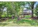 Relax in your backyard with a custom swing set area and a comfortable hammock at 10304 Ebbets Rd, Charlotte, NC 28273
