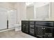 Bathroom with double sink vanity, a walk-in shower, and tile floors at 10304 Ebbets Rd, Charlotte, NC 28273