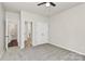 Bedroom with carpeting, two closets, and entrances to a hallway and a bathroom at 10304 Ebbets Rd, Charlotte, NC 28273