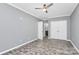 Calm bedroom with light gray walls, ceiling fan and double door closet at 10304 Ebbets Rd, Charlotte, NC 28273