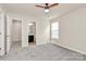 Bedroom featuring carpet and doorways to an ensuite bathroom and closet at 10304 Ebbets Rd, Charlotte, NC 28273