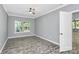 Bright bedroom with large windows and neutral walls, perfect for relaxation at 10304 Ebbets Rd, Charlotte, NC 28273