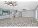 Open concept living room features a bar area and contemporary flooring at 10304 Ebbets Rd, Charlotte, NC 28273