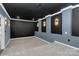 Sleek theater room with recessed lighting, dark walls, and elevated seating at 10304 Ebbets Rd, Charlotte, NC 28273
