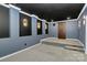 Finished basement theater room featuring dark accent walls and platform seating at 10304 Ebbets Rd, Charlotte, NC 28273