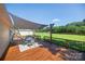 Backyard deck with dining set and shade, overlooking large yard at 106 Abbey Cir, Salisbury, NC 28147