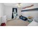 room with a racecar bed, toy shop, and a window overlooking the front yard at 106 Abbey Cir, Salisbury, NC 28147