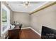 Neutral bedroom featuring a built-in desk and shelf space at 106 Abbey Cir, Salisbury, NC 28147