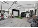 This versatile garage is equipped with a golf simulator, TV and workspace, and an AC Unit at 106 Abbey Cir, Salisbury, NC 28147