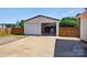 Detached two-car garage with additional workspace and concrete driveway at 106 Abbey Cir, Salisbury, NC 28147