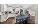 Bright kitchen with granite countertops, white cabinets, and island seating at 106 Abbey Cir, Salisbury, NC 28147