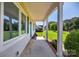 Inviting covered front porch with ample space for seating, providing a relaxing transition to the outdoors at 106 Abbey Cir, Salisbury, NC 28147