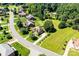 A beautiful aerial view of homes on a quiet street surrounded by lush, green landscaping at 1083 Fox Chase Dr, Newton, NC 28658
