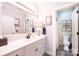 Bathroom with a large vanity, decorative mirror and doorway to the toilet and walk-in shower at 1083 Fox Chase Dr, Newton, NC 28658
