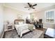 Comfortable bedroom featuring a ceiling fan, desk, a large window, and a patterned area rug at 1083 Fox Chase Dr, Newton, NC 28658