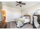 Bright bedroom featuring a ceiling fan, desk, a large window, and hardwood flooring at 1083 Fox Chase Dr, Newton, NC 28658