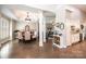 Open-concept dining area with hardwood floors and modern lighting at 1083 Fox Chase Dr, Newton, NC 28658