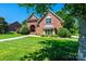 Beautiful brick home with arched entryway and well-maintained lawn at 1083 Fox Chase Dr, Newton, NC 28658
