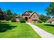 Charming brick home with a manicured lawn and mature landscaping at 1083 Fox Chase Dr, Newton, NC 28658