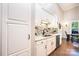 Charming kitchen features white cabinetry, a tiled backsplash, and stainless steel appliances at 1083 Fox Chase Dr, Newton, NC 28658