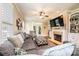 Cozy living room with fireplace, built-in shelves, and ample seating at 1083 Fox Chase Dr, Newton, NC 28658