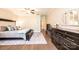 Comfortable main bedroom with a ceiling fan, plush carpet, a sitting area and an ensuite bathroom at 1083 Fox Chase Dr, Newton, NC 28658