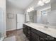 Well-lit bathroom featuring a double sink vanity, tile flooring, and a glass-enclosed shower at 117 Autumn Mist Rd, Statesville, NC 28677