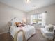 Inviting bedroom with a cozy bed, plush pillows, and natural light from the window at 117 Autumn Mist Rd, Statesville, NC 28677