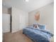 Cozy bedroom features a bed with blue comforter, a colorful dream catcher, and neutral walls at 117 Autumn Mist Rd, Statesville, NC 28677