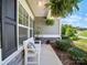 Charming front porch with a welcoming bench, hanging plants, and stylish stone accents at 117 Autumn Mist Rd, Statesville, NC 28677